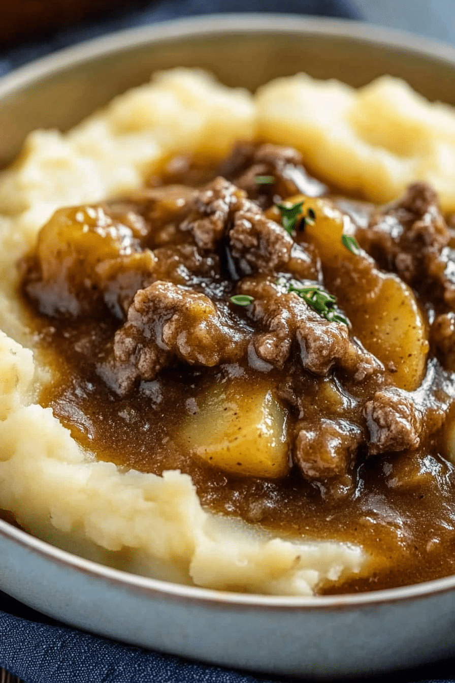 Spoonful of Beef Gravy Potatoes lifted from bowl