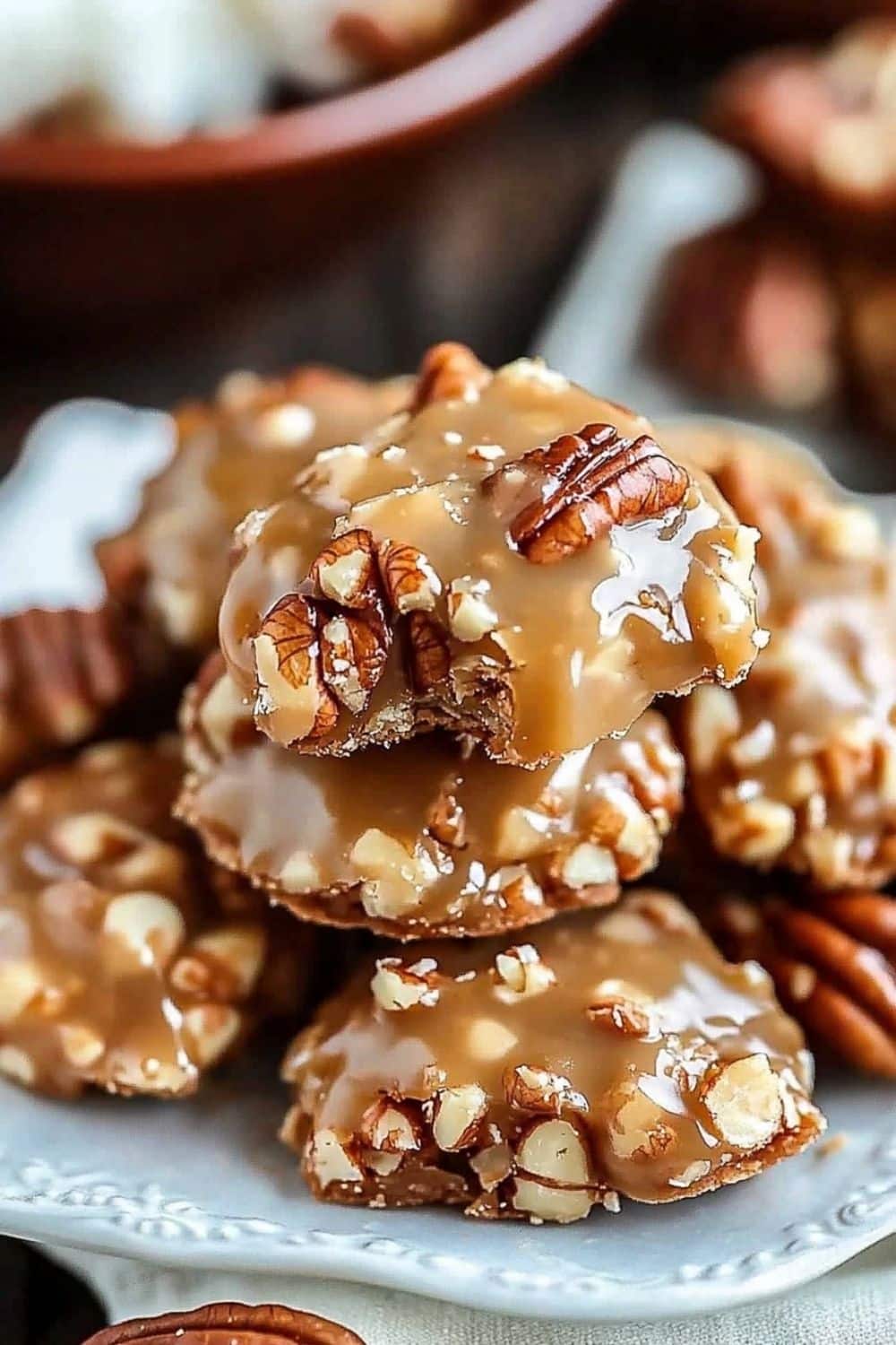 Hand holding a warm praline for first bite.