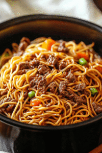 Crockpot ground beef chow mein topped with green onions