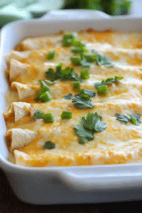 Creamy chicken enchiladas baked with melted cheese