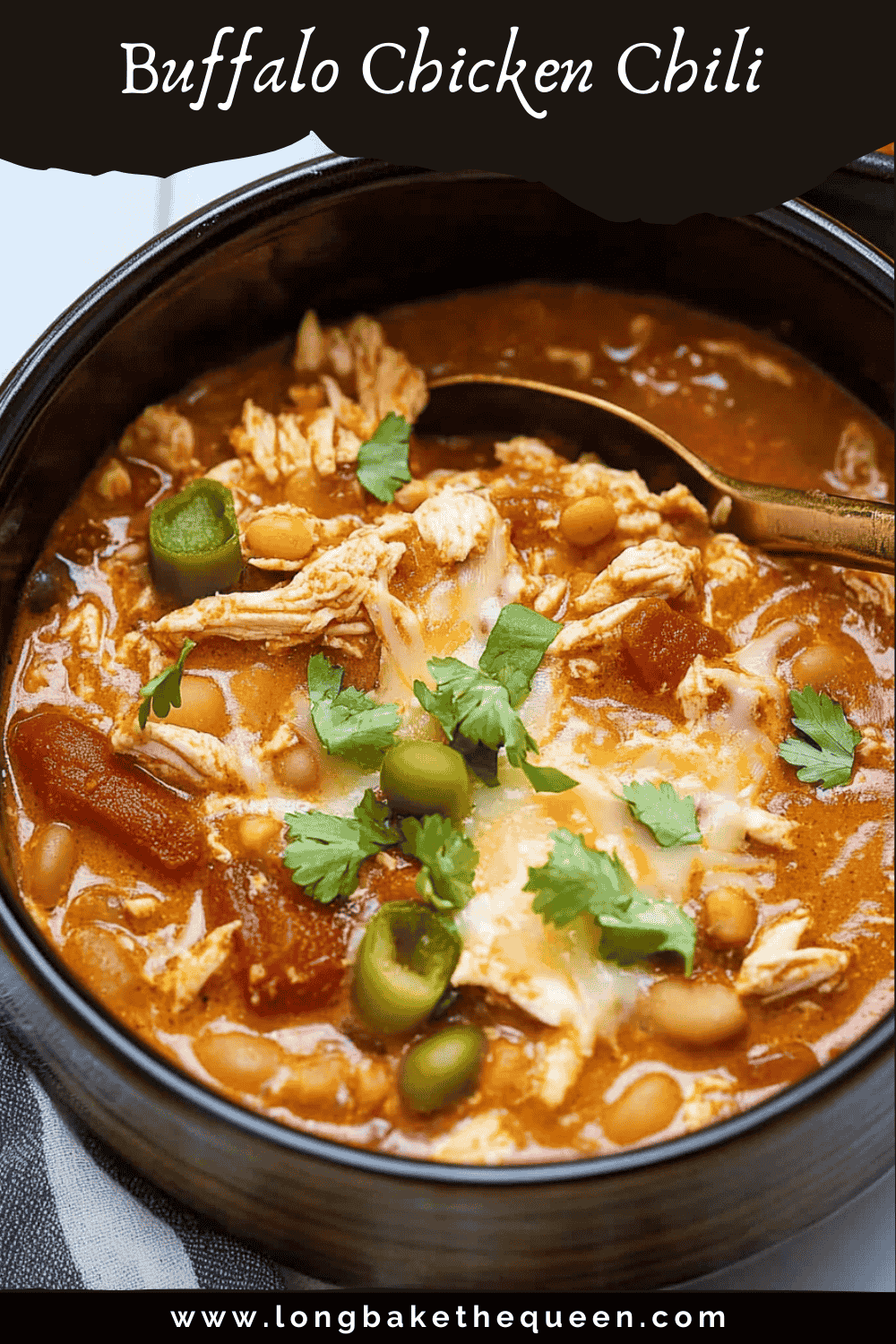 Bowl of buffalo chicken chili with toppings