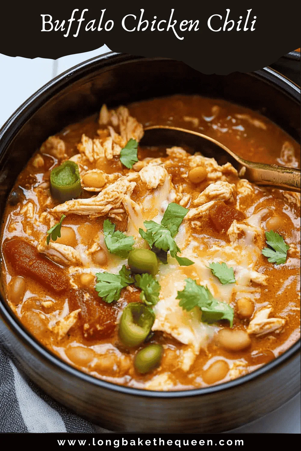 Bowl of buffalo chicken chili with toppings