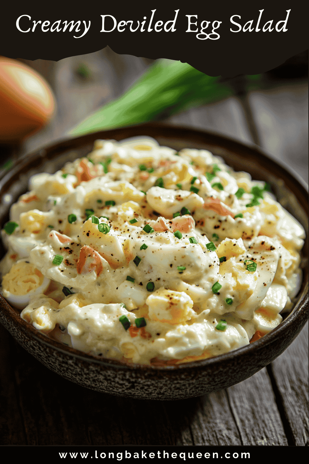 Bowl of creamy deviled egg pasta salad with bacon and green onions