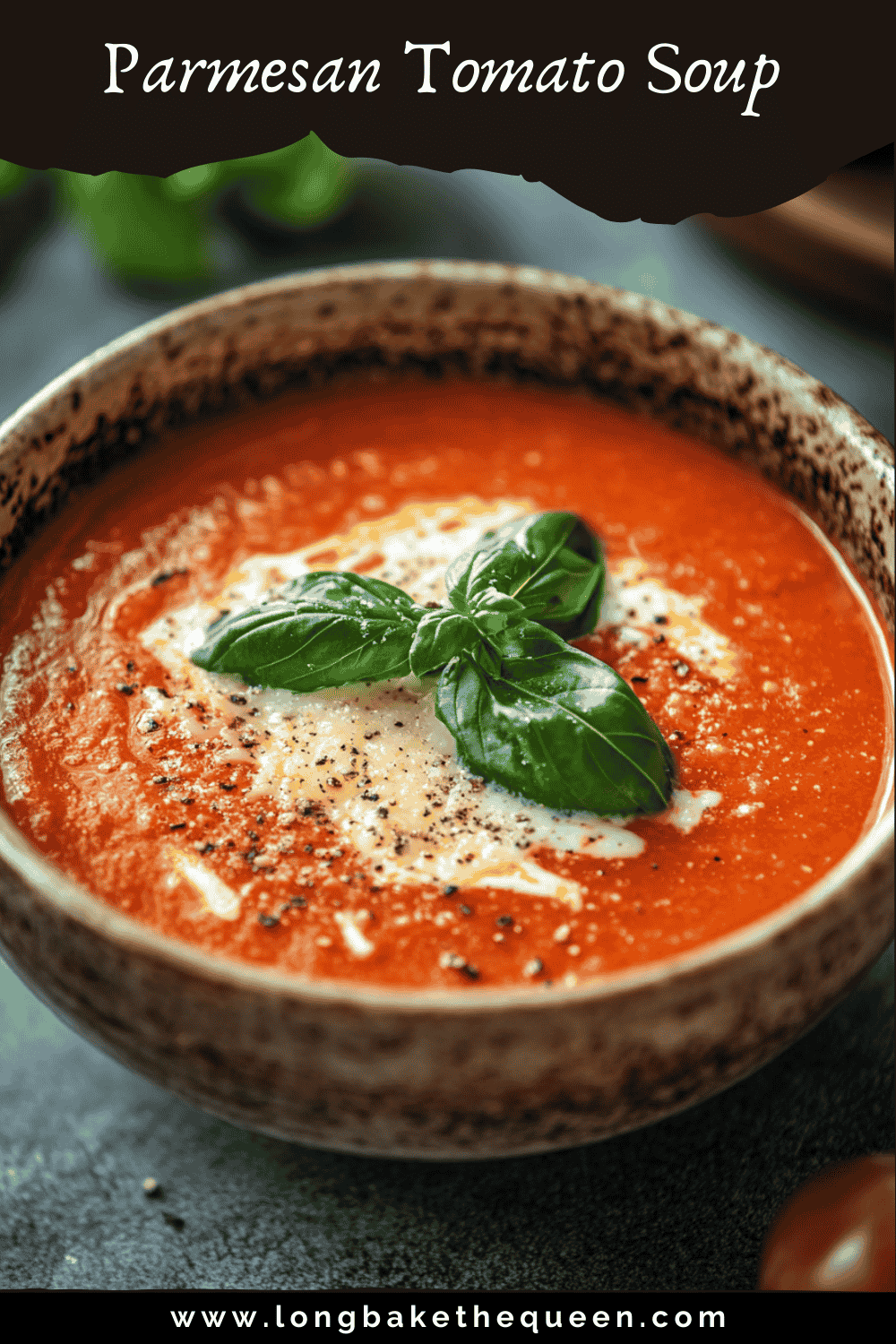 Bowl of Parmesan tomato soup garnished with basil