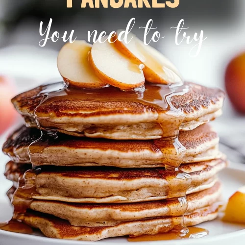 Stack of apple butter pancakes with drizzled syrup and butter on top.