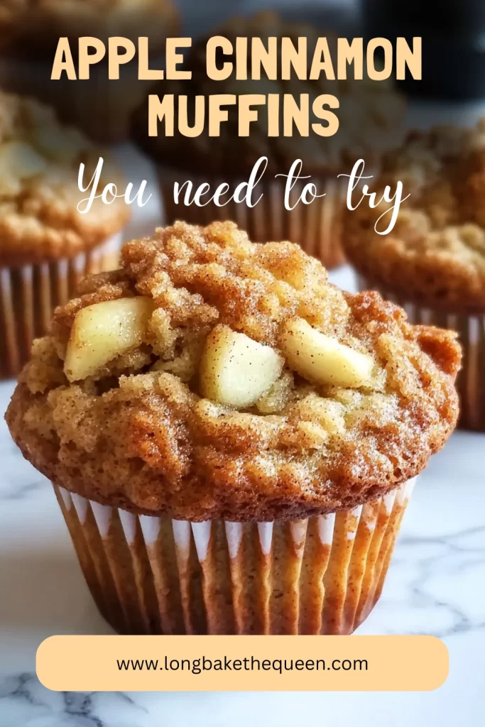Freshly baked apple cinnamon muffins on rustic wooden board.