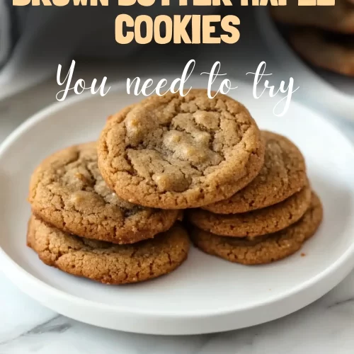 Stack of freshly baked brown butter maple cookies on a plate.