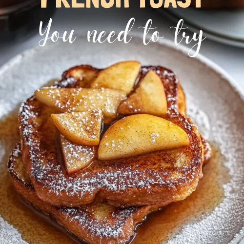 Golden cinnamon apple french toast served with sliced apples.