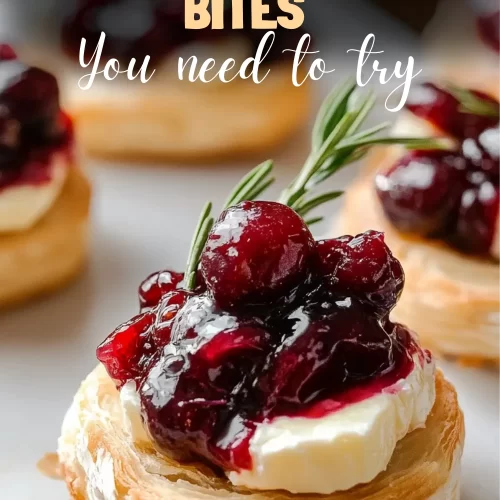 Golden cranberry brie bites on rustic serving board.