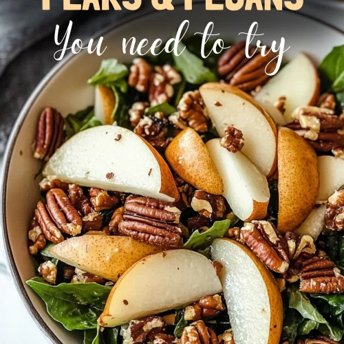 Colorful bowl of harvest salad pears pecans with greens and cheese.