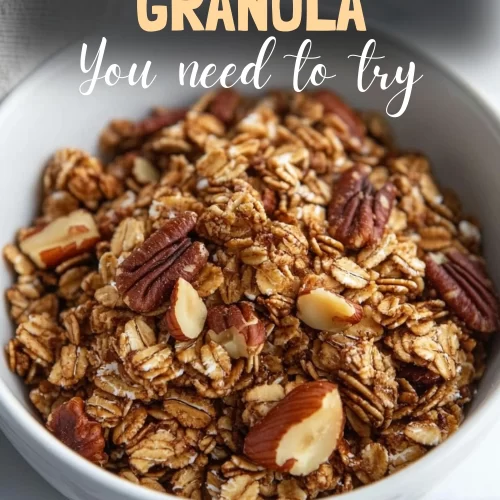 Golden-brown bowl of maple pecan granola with almonds and oats.