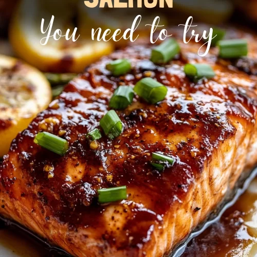 Perfectly baked maple glazed salmon fillet on a white plate.