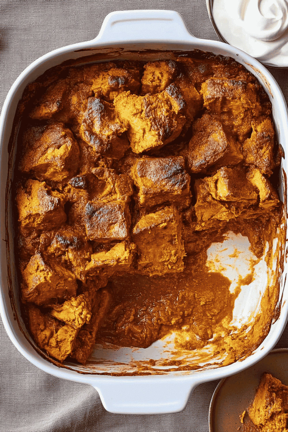 pumpkin bread pudding topped with whipped cream