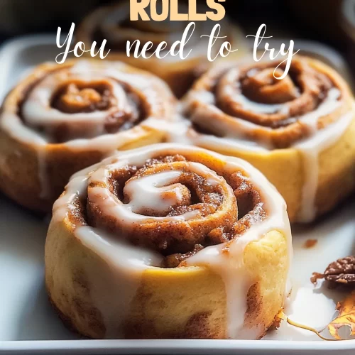 Freshly baked pumpkin cinnamon rolls with glaze on top