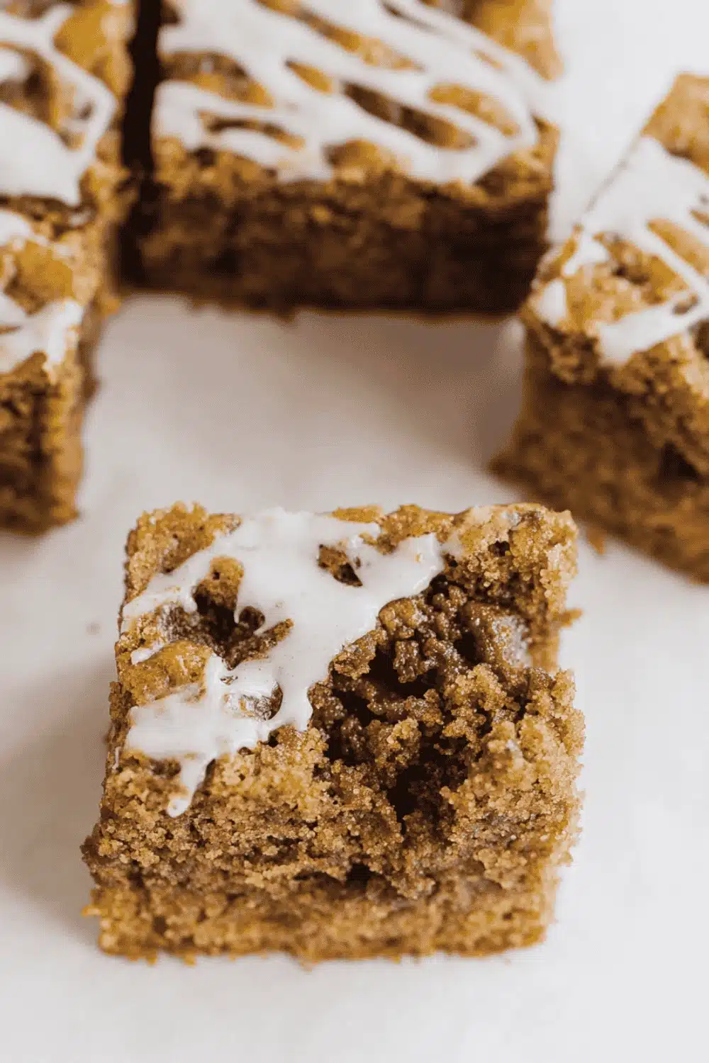 Slice of pumpkin spice coffee cake plated with cinnamon dust