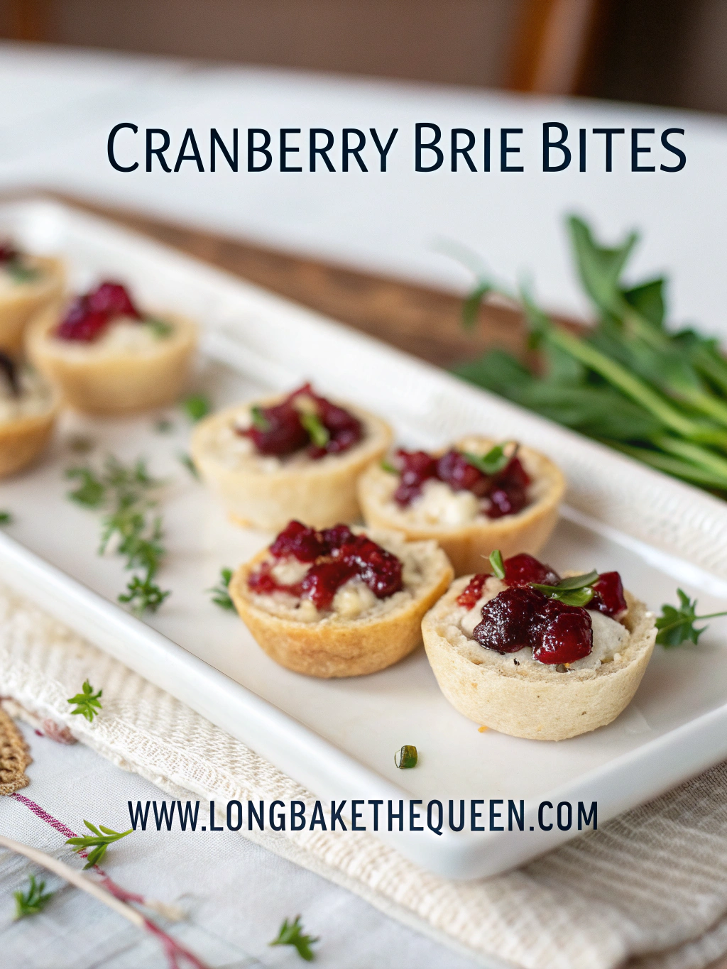 Golden cranberry brie bites on rustic serving board.