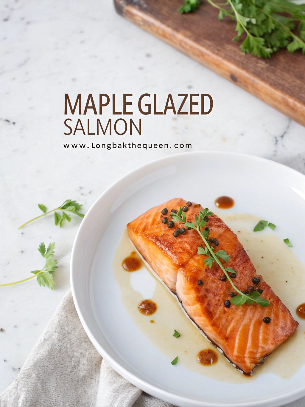 Perfectly baked maple glazed salmon fillet on a white plate.