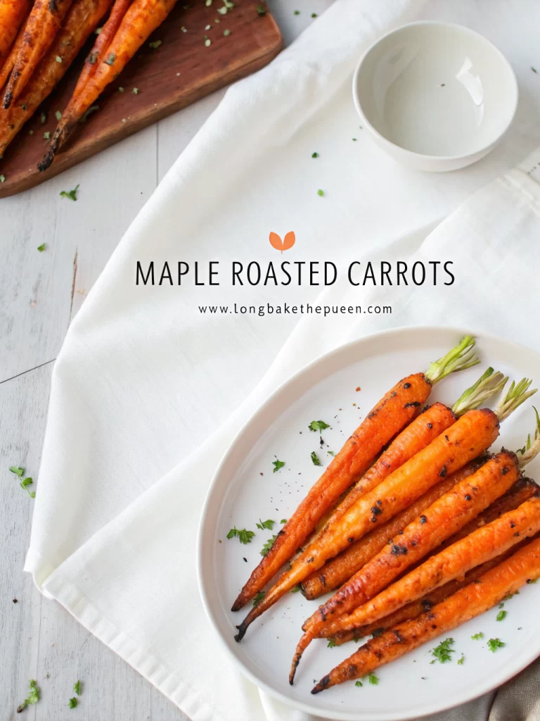 Golden maple roasted carrots glistening with caramel glaze on tray