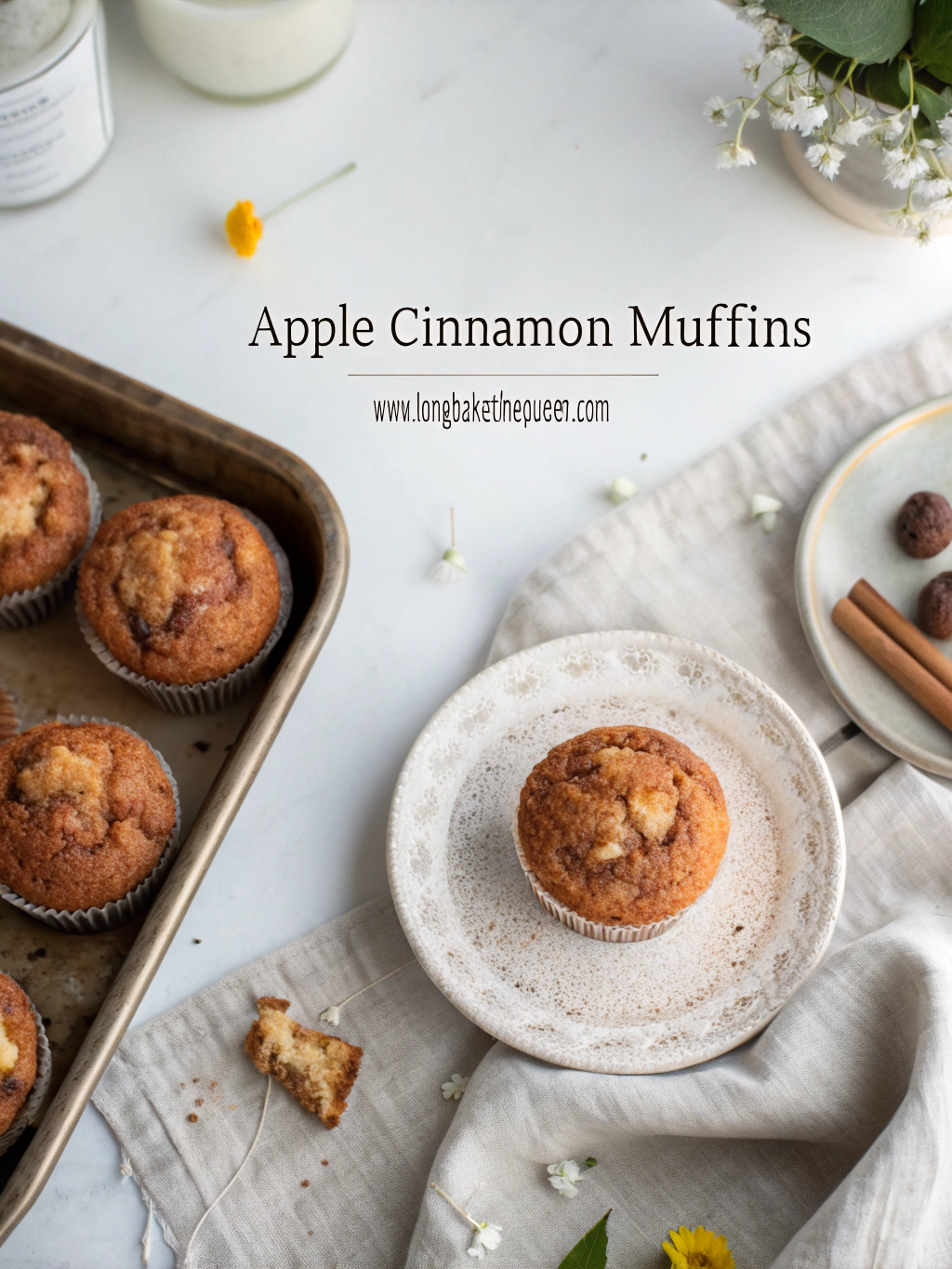 Freshly baked apple cinnamon muffins on rustic wooden board.