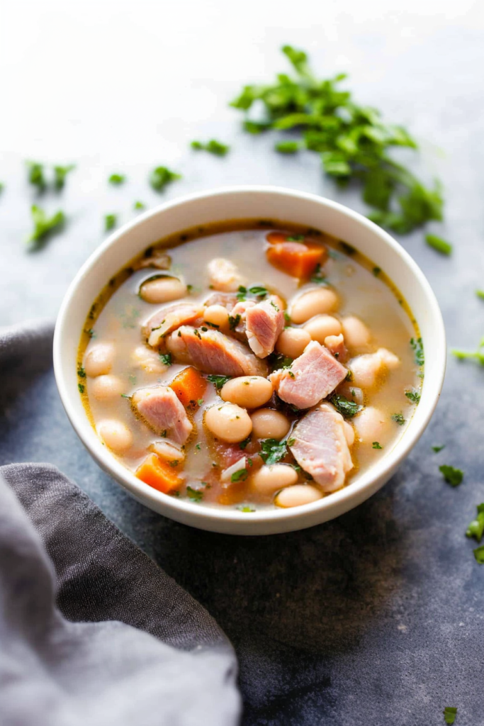 Warm, comforting soup with beans and ham, styled for a cozy winter meal.