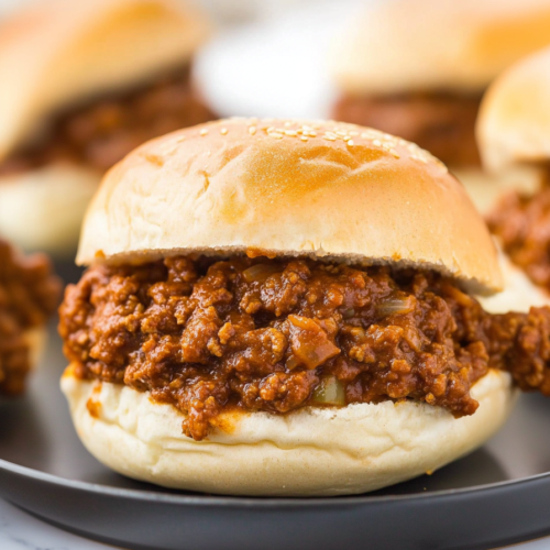 Final plated shot highlighting the saucy ground beef spilling from a toasted bun.