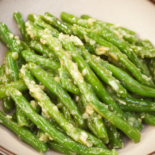 Crisp green beans tossed with garlic and a light savory coating.