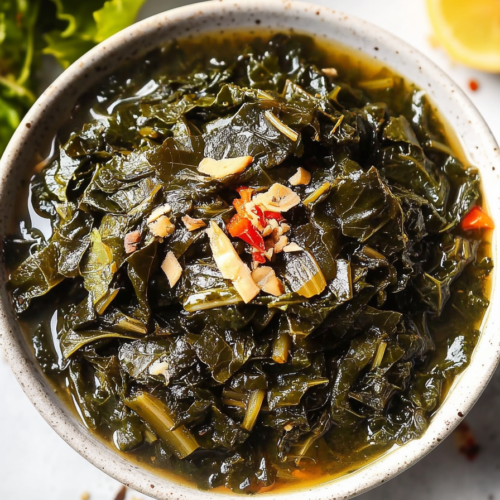 Classic Southern collard greens, served warm with colorful peppers and onions.