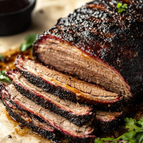 Slow-cooked beef brisket cut into thick slices with visible juices.