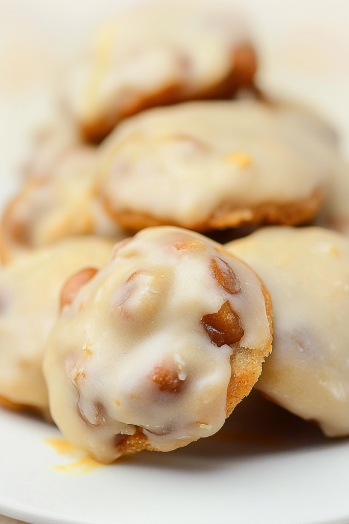 Glazed cookie bites with a soft, golden center and slightly crisp edges on a white plate