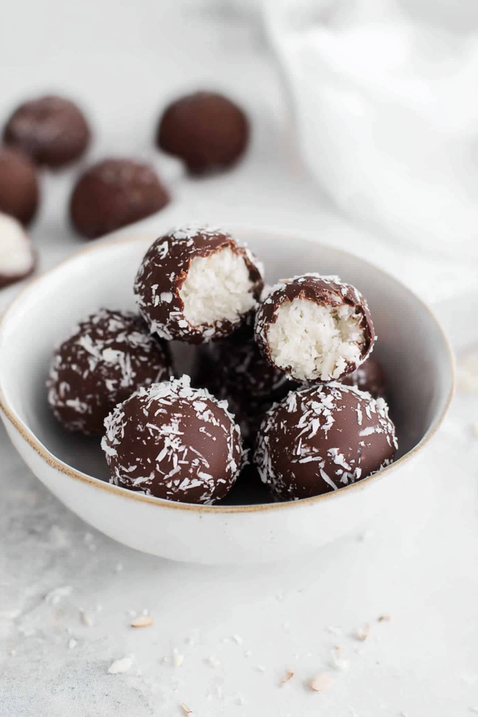 Sweet coconut treats with a rich chocolate shell and fluffy coconut filling.