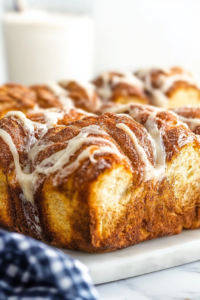 Close-up of sweet, pull-apart bread with a powdered sugar glaze.