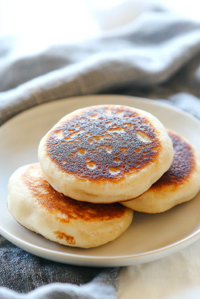 Freshly cooked Korean street-style pancakes with caramelized sugar filling peeking through the surface.