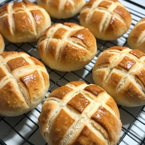 Close-up of golden bread buns with a signature patterned crust