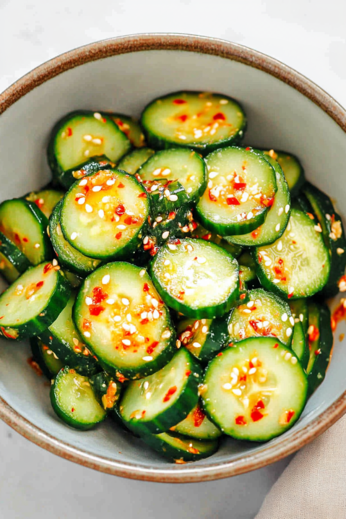 Fresh cucumber slices coated in a glossy, lightly spicy seasoning