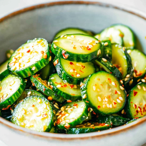 Seasoned cucumber slices with sesame seeds and red pepper flakes