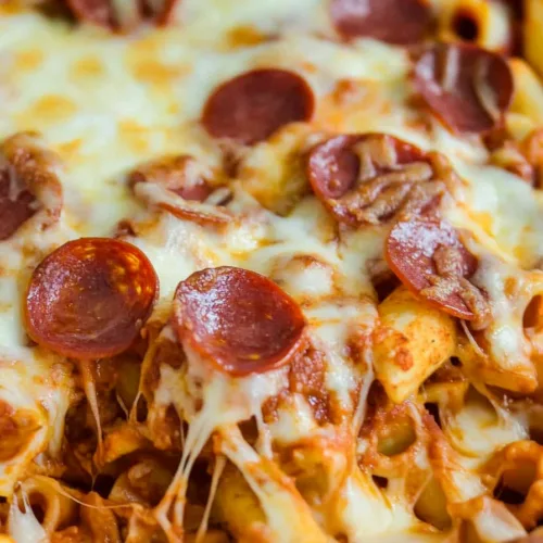 Quick Pizza Casserole fresh from the oven, with browned cheese and vibrant tomato sauce peeking through.