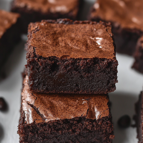 Close-up of moist chocolate brownies with deep cocoa color and soft centers