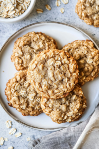 Close-up of golden oatmeal cookies showing a tender, crinkled surface
