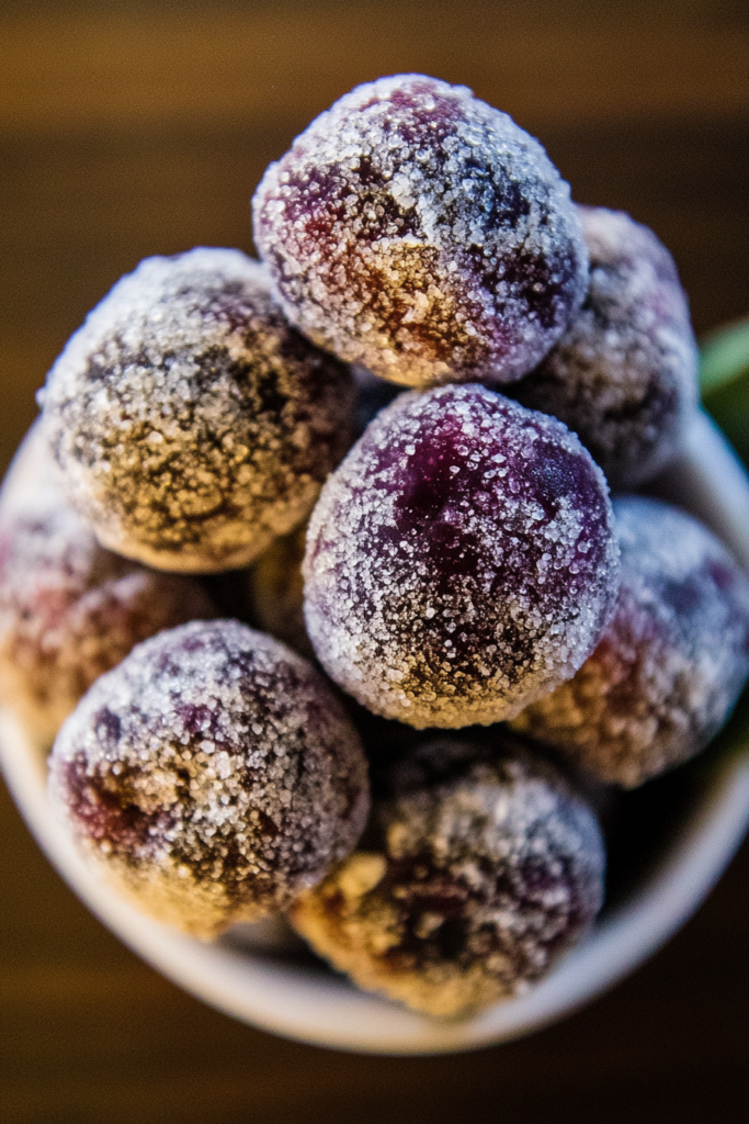 Sweet Sugar Plums Recipe presented in a rustic bowl, dusted with sparkling sugar