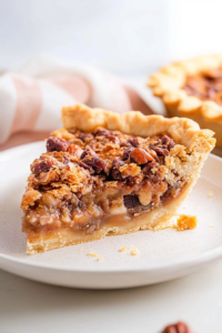 Close-up of the pie’s golden crust and crumbly topping, highlighting the mix of textures.