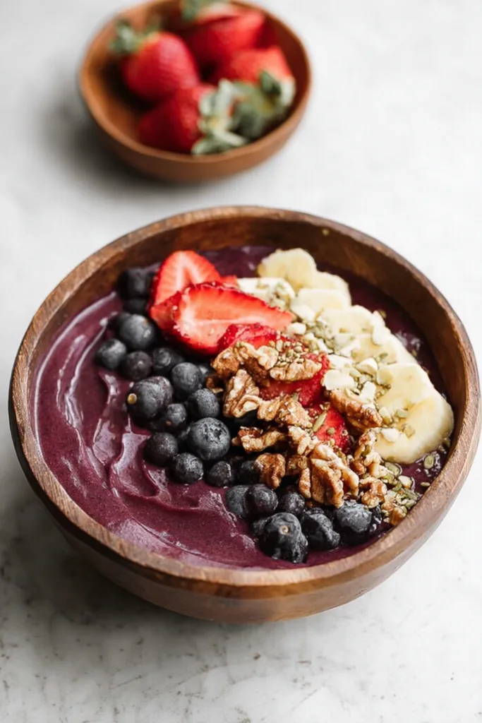 Thick blended fruit bowl finished with fresh berries and crunchy toppings.