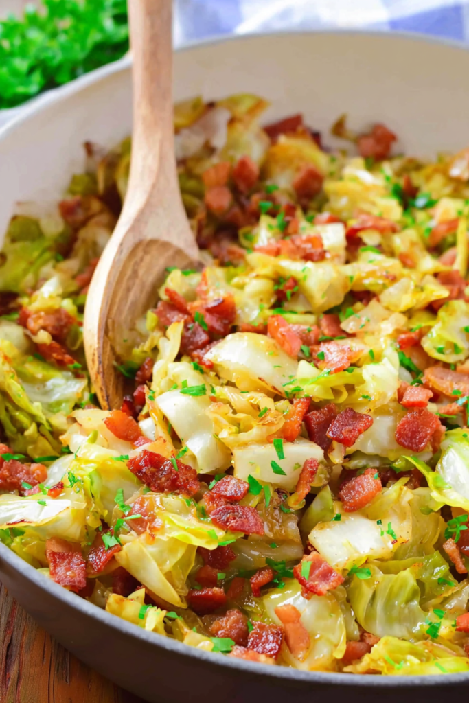 Homestyle fried cabbage mixed with chopped bacon and onions for a savory side dish