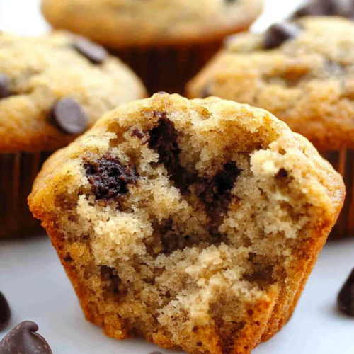Homemade banana chip muffins with a rich coffee twist and crisp golden tops.