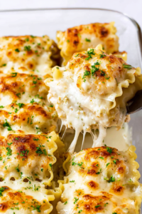 Comforting homemade pasta bake with bubbly cheese topping and herbs