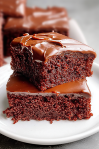 Final presentation of Chocolate Texas Sheet Cake, cut into squares and ready to serve.