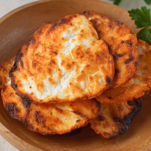 Close-up of crunchy baked cheese chips showing their bubbly texture