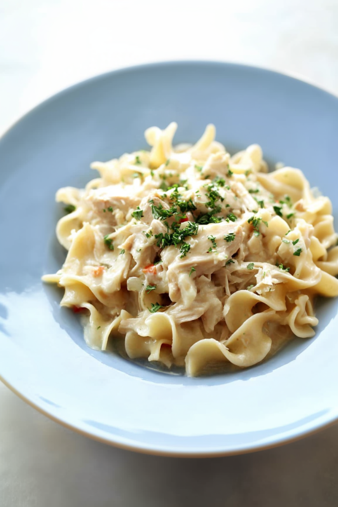 Tender chicken mixed with egg noodles in a thick, savory cream sauce.