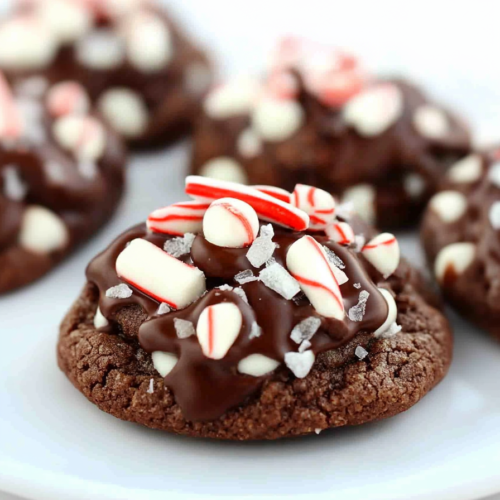 Rich cocoa cookie loaded with white chocolate chunks and festive red-and-white candy cane bits.