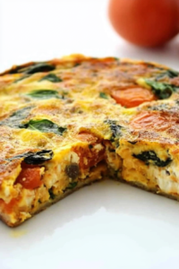 Close-up of a slice revealing fluffy eggs and melted cheese inside.