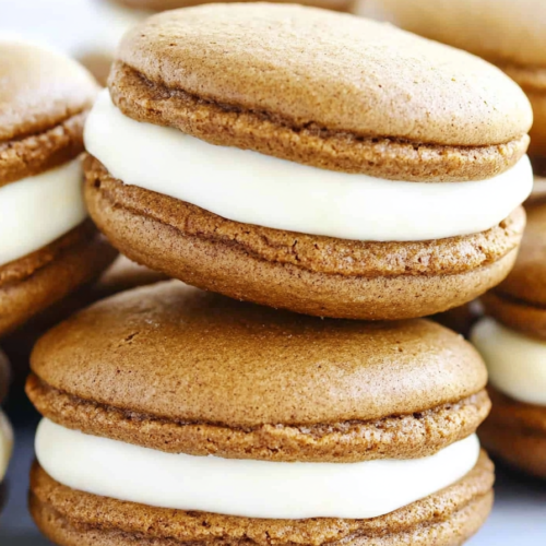 Dessert plate filled with rich brown whoopie pies, ready to serve.